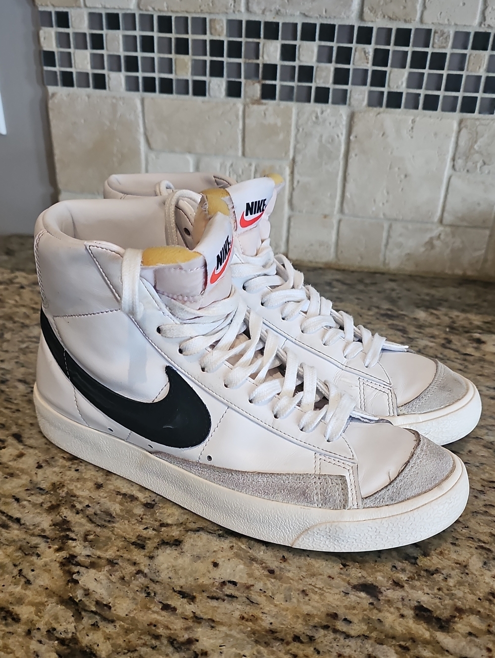 Nike Men’s White High-Top Sneakers with Black Swoosh and Pink Tongue Logo